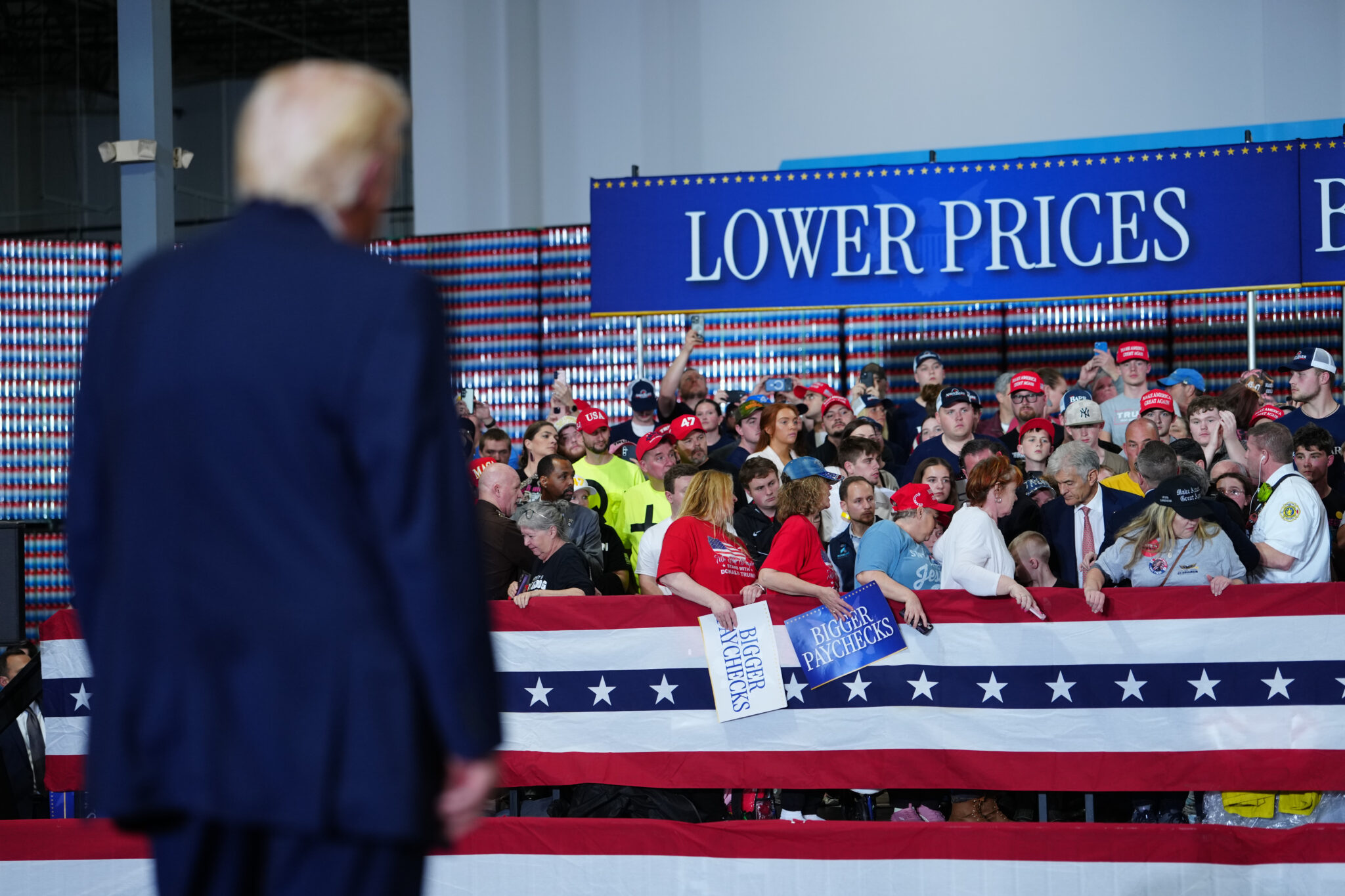 President Donald Trump watches as Centers for Medicare & Medicaid Services administrator Dr. Mehmet Oz helps first responders with a medical emergency in the crowd at Verst Logistics Wednesday, March 11, 2026, in Hebron, Ky. (AP Photo/Julia Demaree Nikhinson)