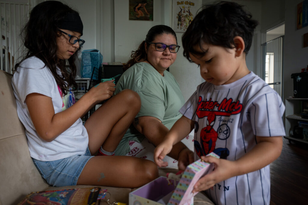 Patty Chin with her daughter, Sophia, 11, left and Phoenix, 2, at their Pearl City home April 2, 2026. Chin has been advocating for children in foster care because of her experience in foster care.. (Craig Fujii/Civil Beat/2026)