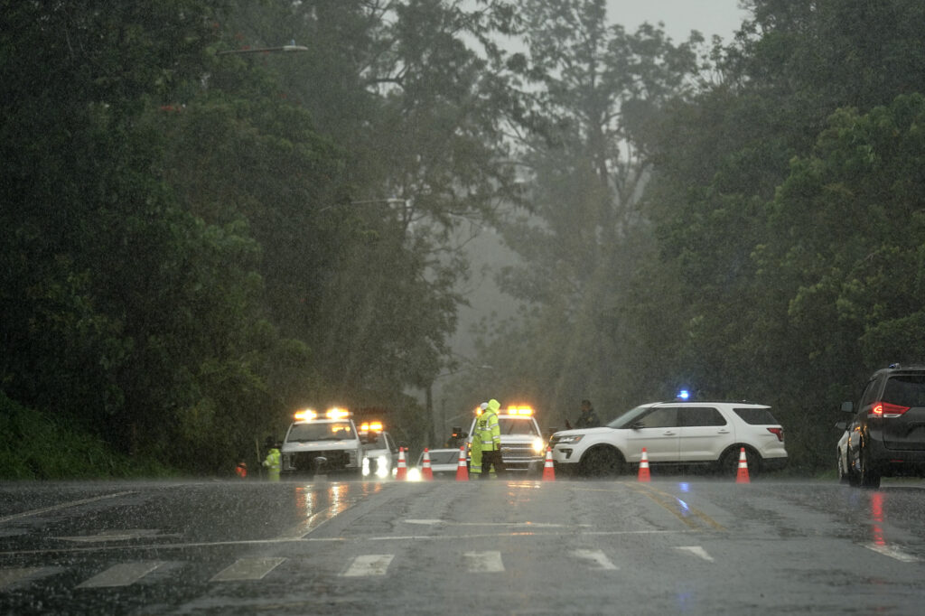 Officials block the Karsten Thot Bridge over the Wahiawā Reservoir/Lake Wilson leading toward the North Shore on Kamehameha Highway out of Wahiawā Friday, April 10, 2026. The North Shore community is on edge after flooding from a recent Kona Low storm. (Kevin Fujii/Civil Beat/2026)