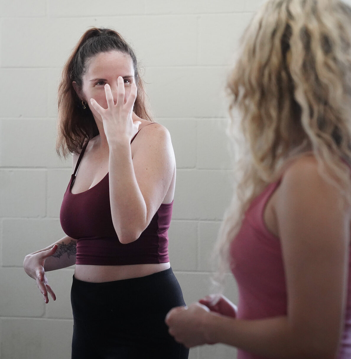 Certified unarmed combat instructor Jasmine Haley emphasizes facial and body reactions with student Miriam Yazdanpanahi Saturday, April 11, 2026, at Manoa Valley Theatre in Honolulu. Yazdanpanahi is working on her Dueling Arts International certification. (Kevin Fujii/Civil Beat/2026)