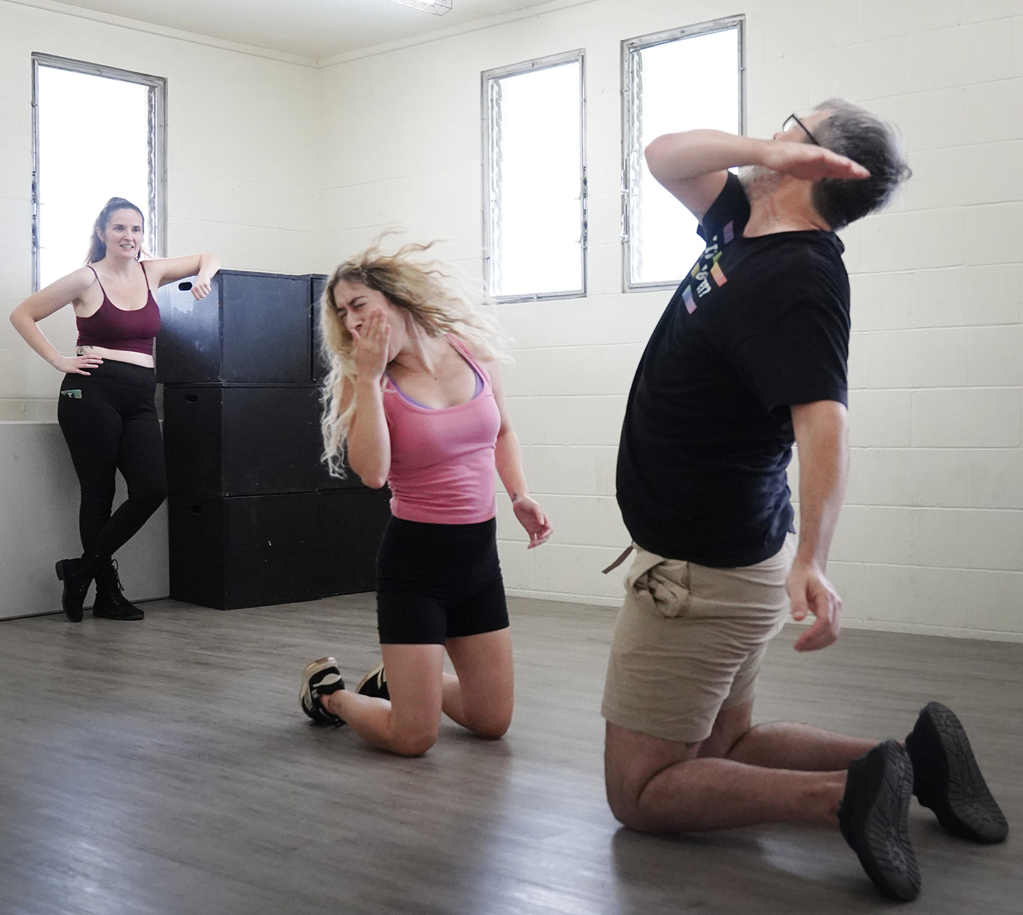 Instructor Jasmine Haley Anderson, from left, watches Miriam Yazdanpanahi and Andrew Simmons rehearse a choreographed unarmed stage combat scene Saturday, April 11, 2026, at Manoa Valley Theatre in Honolulu. Anderson is a certified instructor through Dueling Arts International. (Kevin Fujii/Civil Beat/2026)