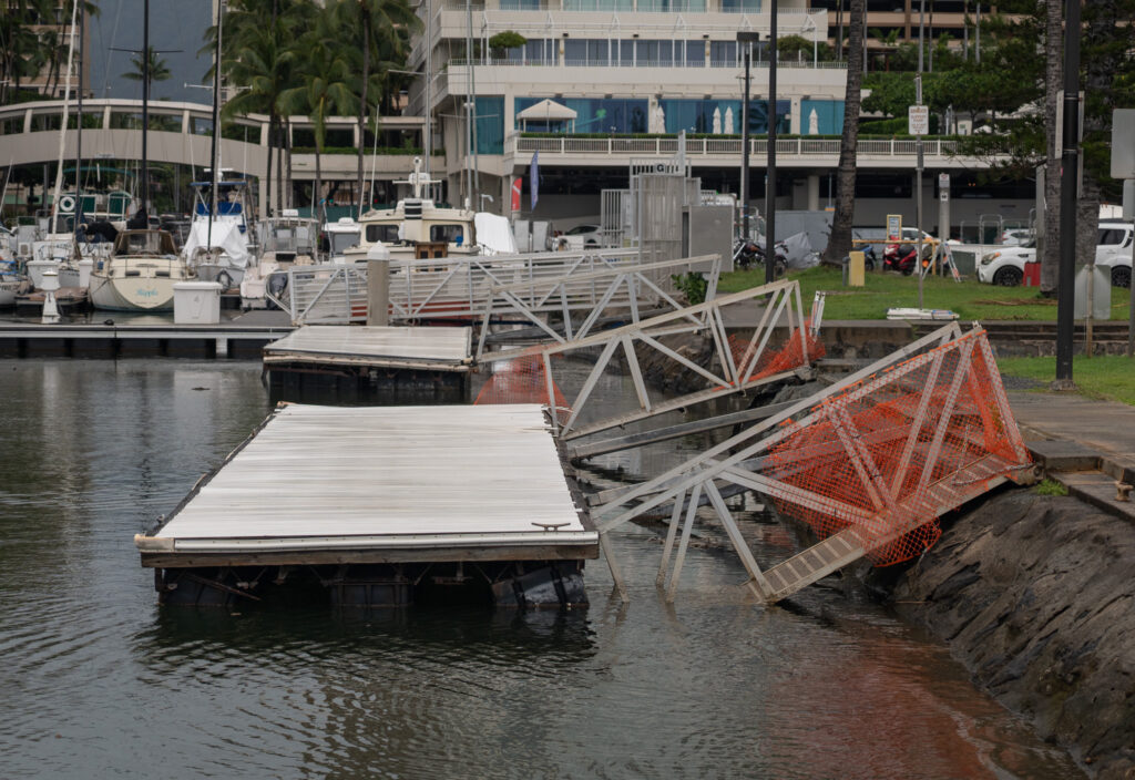 One of the floating docks, closest to the camera,  at the boat ramp of Ala Wai Harbor remains damaged and unuseable April 13, 2026. The gang planks are closed for safety. (Craig Fujii/Civil Beat/2026)