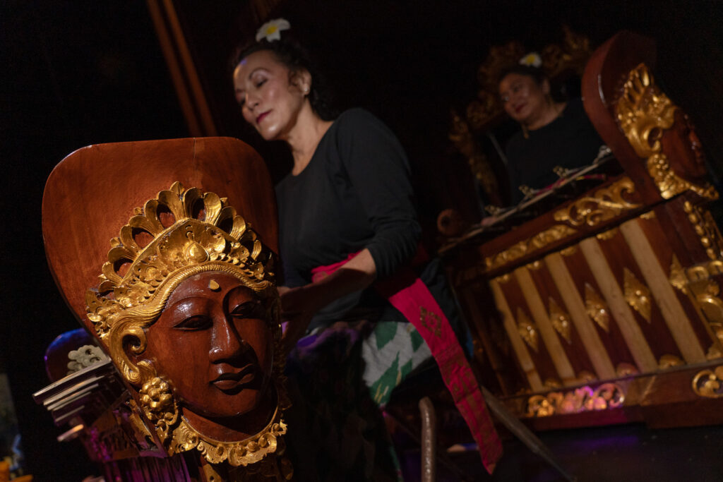 Gamelan ensemble members Dana Kwong and Aidha Lopez practice between rehearsals using Balinese instruments at Kennedy Theatre April 16, 2026. The gamelan has been practicing for a year and half for six live performances. (Craig Fujii/Civil Beat/2026)