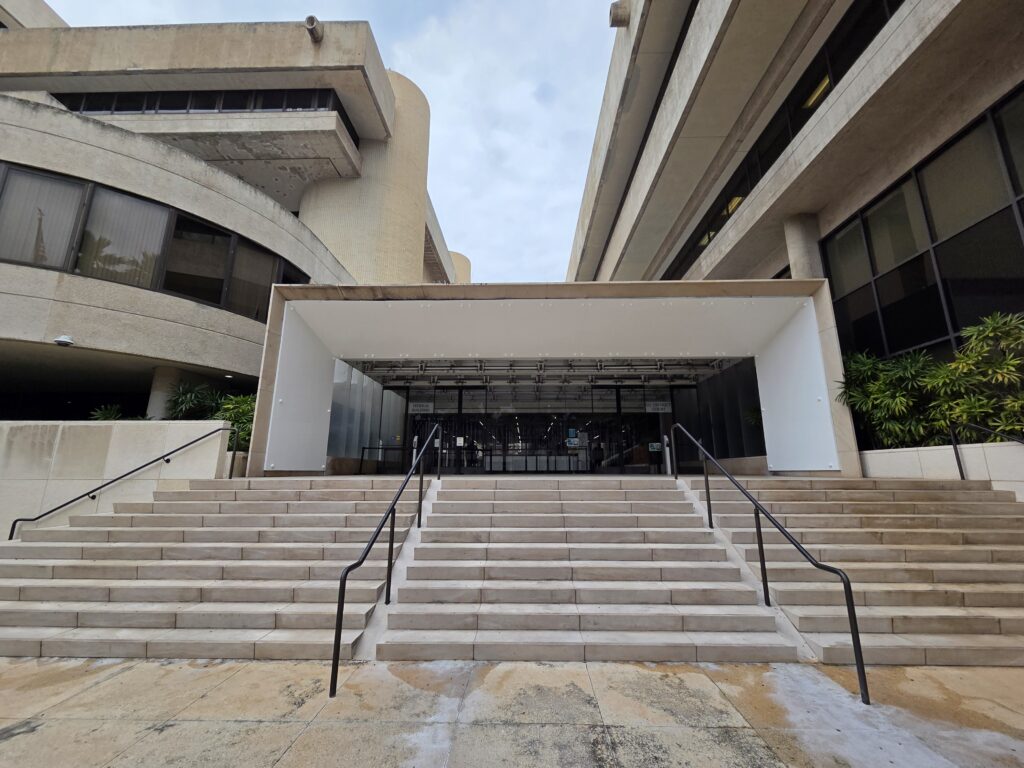 At the Prince Kūhiō Federal Building in Honolulu, the entrance to the immigration courts is on the left and the entrance to the federal district courts, where habeas petitions are filed, is on the right.