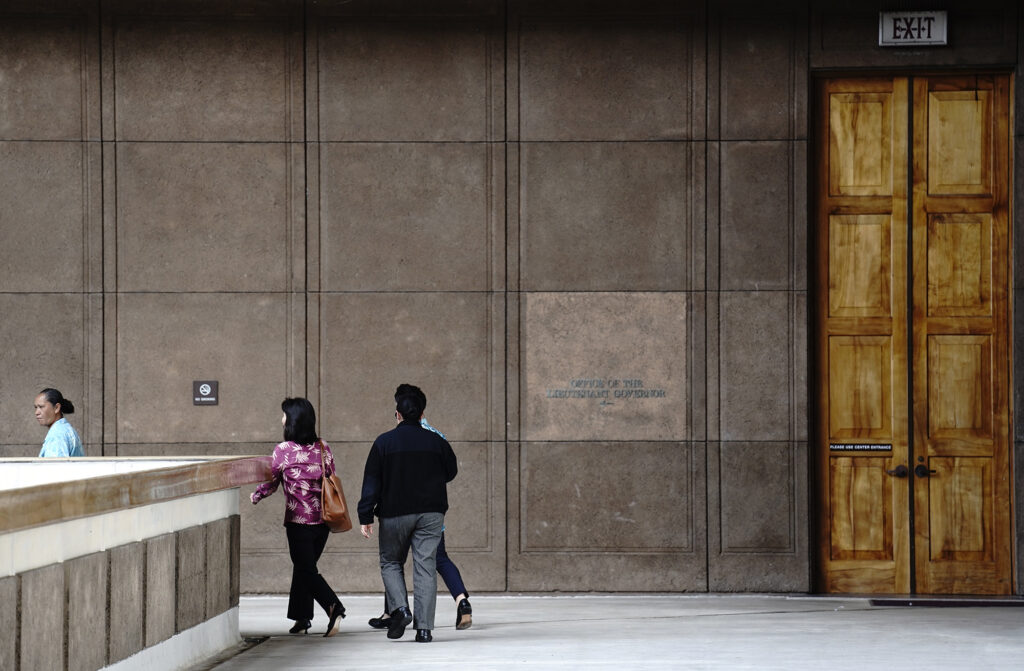 Lt. Gov. Sylvia Luke leaves the governor’s office with aides and security Thursday, April 23, 2026, in Honolulu. (Kevin Fujii/Civil Beat/2026)