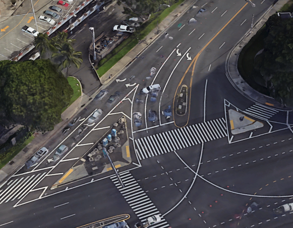 Aerial photo of intersection with lots of stripes marking pedestrian crosswalks.
