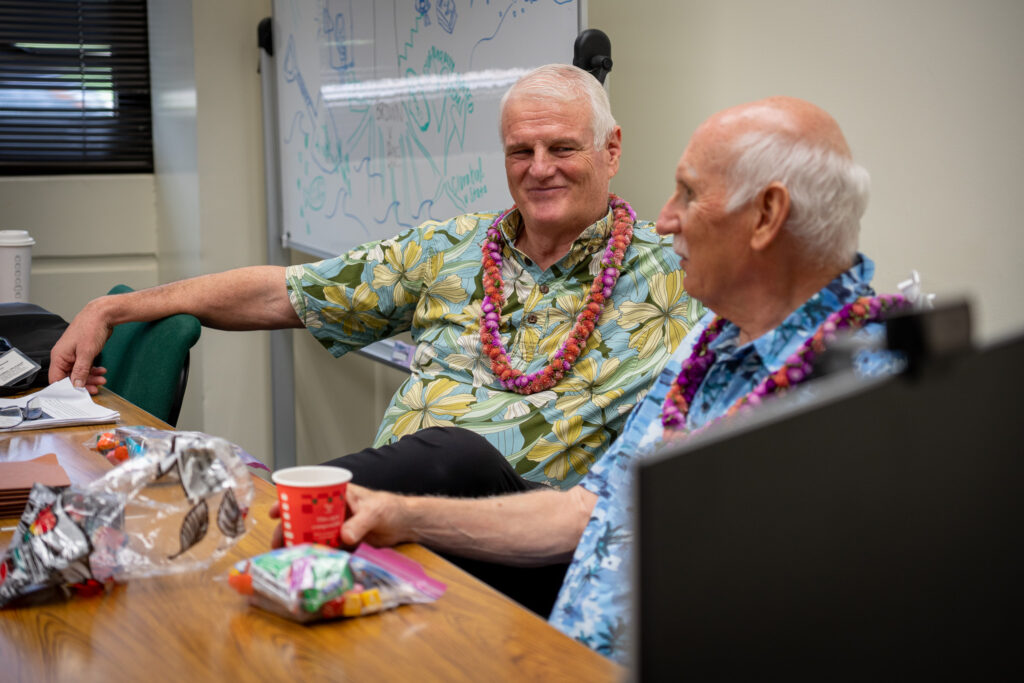 Retired Chief Justice Mark Recktenwald grins while speaking with retired law school Dean Avi Soifer during a seminar at the William S. Richardson School of Law April 30, 2026. (Craig Fujii/Civil Beat/2026)