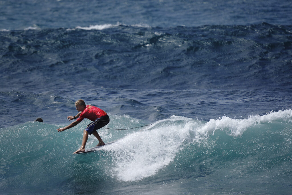 Maui’s Bode Davis of Kulanihakoi High School gets his toes on the nose of his longboard during the inaugural Hawaiʻi High School Athletics Association surfing state championships in the boys longboard final Saturday, May 2, 2026, at Hoʻokipa Beach Park in Pāʻia. Davis finished in fourth place. (Kevin Fujii/Civil Beat/2026)