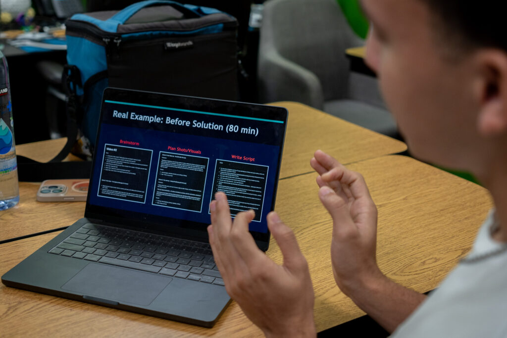An AI-driven project is shown on Kingston Collman's laptop at Hawaiʻi Technology Academy in Waipahu May 4, 2026. Collman is at right. (Craig Fujii/Civil Beat/2026)
