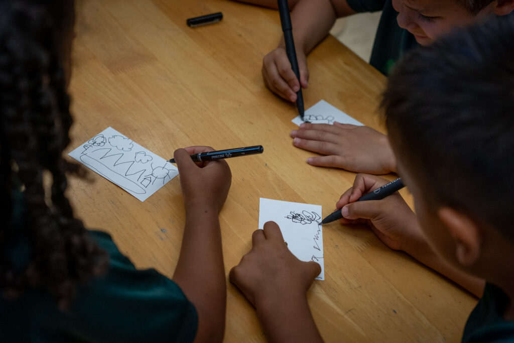 Students work to answer a question with small focused drawings in a class at Mid-Pacific Institute in Mānoa May 6, 2026. The children here are five years old. (Craig Fujii/Civil Beat/2026)