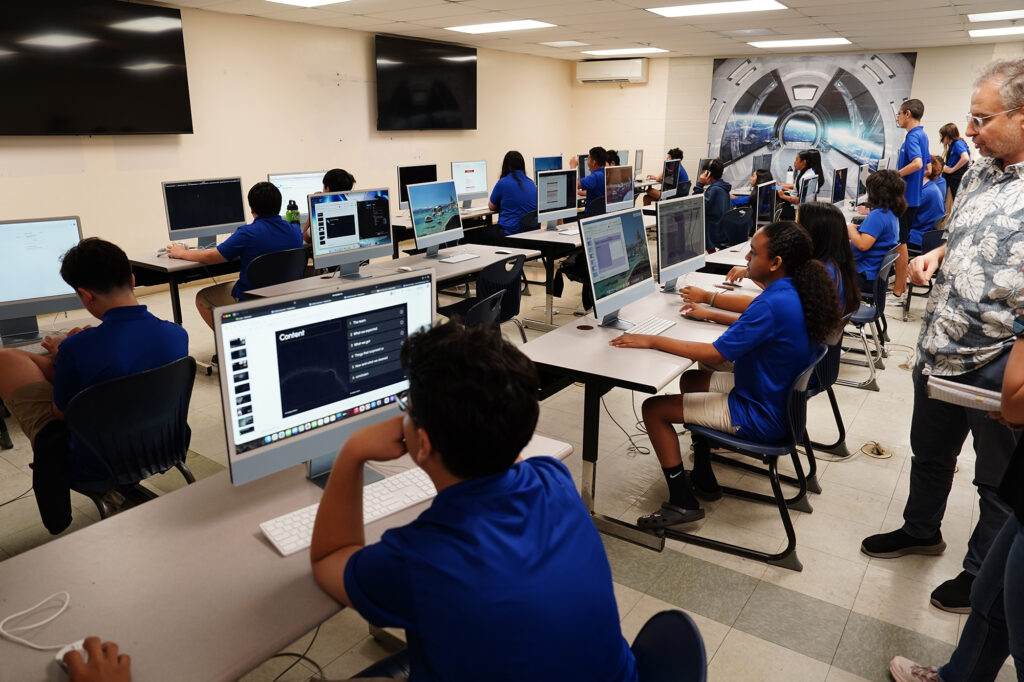 Kūlia Academy executive director Andy Gokce, right, watches a coding class Thursday, May 7, 2026, in Honolulu. (Kevin Fujii/Civil Beat/2026)