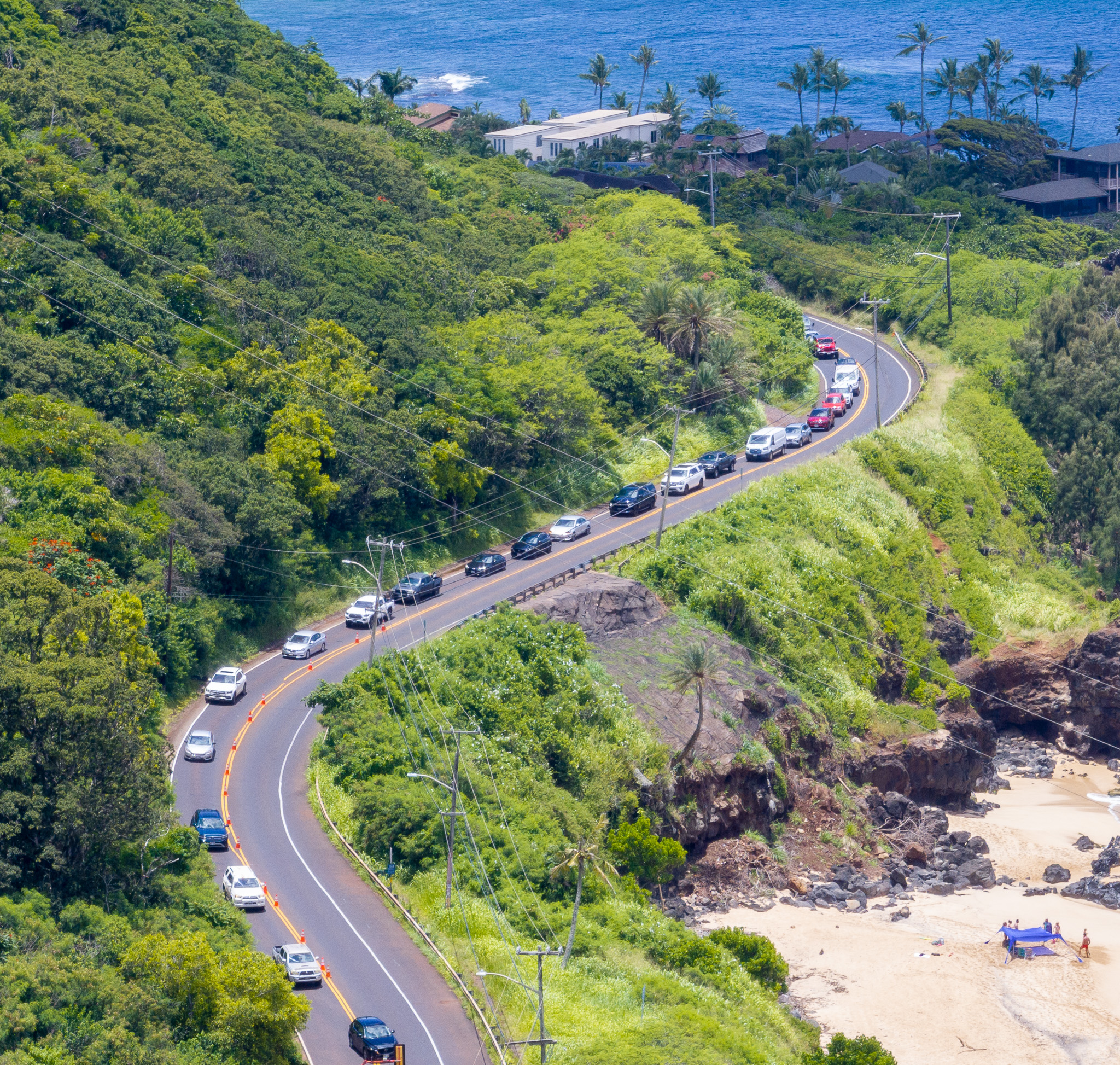 Kahuku-bound traffic moves single file over Kamehameha Highway at Waimea Bay May 11, 2026. Rock falls and landslides have created a safety which is being shored up by the Department of Transportation. (Craig Fujii/Civil Beat/2026)