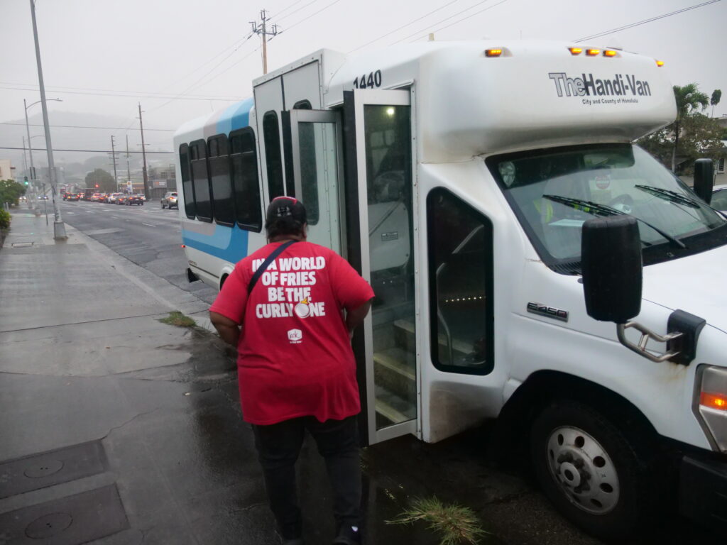 Andarina Petero boards a Handi-van, after work in Honolulu ,that will take back to the shelter in Waianae where she is staying until she can find more permanent housing for her and her daughter.. (Civil Beat photo Ronen Zilberman)