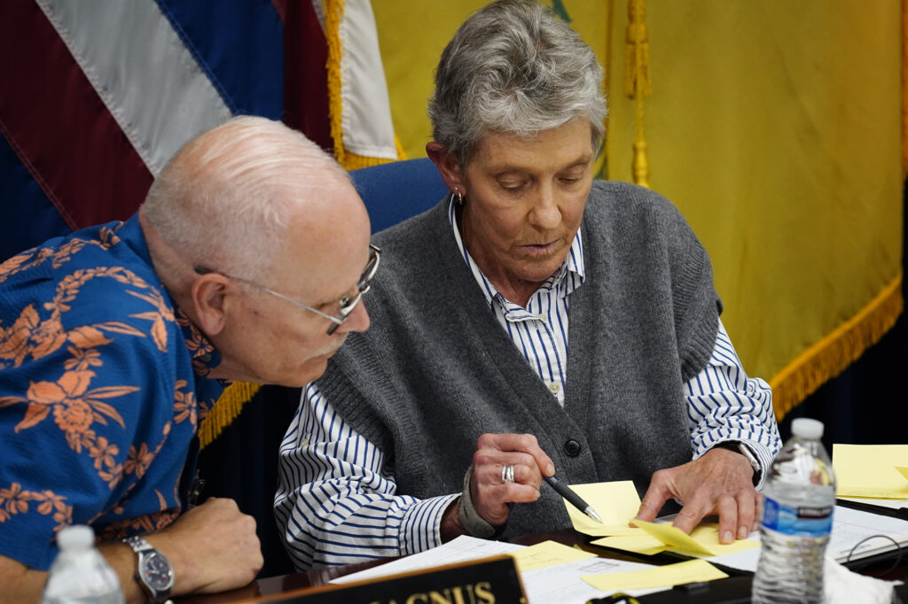 Honolulu Police Commission vice-chair Chris Magnus, left, confirms the votes for a new chief with chair Laurie Foster Wednesday, May 20, 2026, in Honolulu. David Lazar was selected with 5-2 beating out Mike Lambert. Scott Ebner received zero votes. (Kevin Fujii/Civil Beat/2026)
