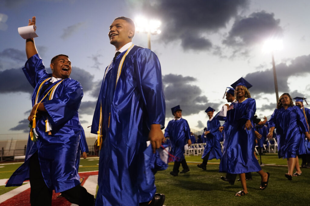 Waiʻanae High School graduates walk off Raymond Torii Field after their commencement ceremony Friday, May 22, 2026, in Waiʻanae. (Kevin Fujii/Civil Beat/2026)